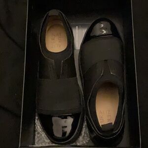 Black Leather Cori slip on shoes with patent toes and heel